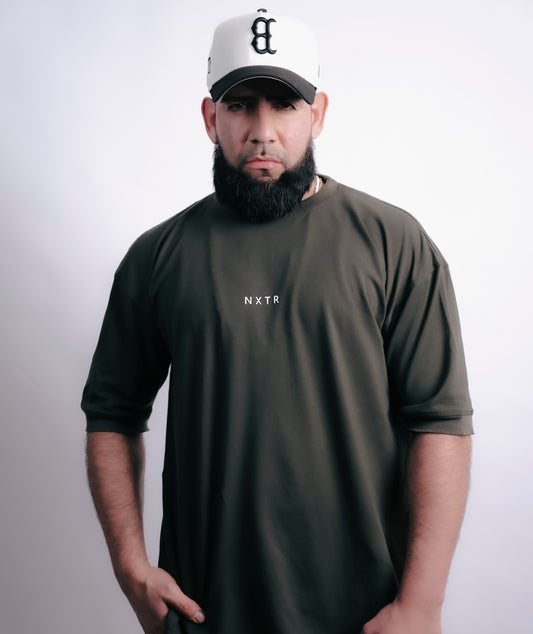 Military green oversized — subtle flex, strong presence.